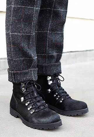 lace up black boots with silver eyelets