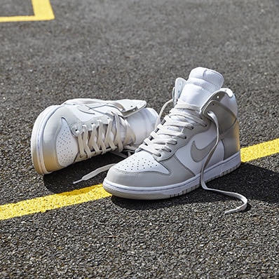 Nike Dunk High in Light Bone and White on a basketball court