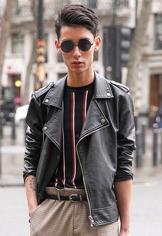 street style guy in high-waisted trousers and leather jacket