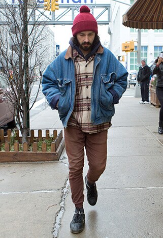Shia LaBeouf wearing a boxy denim jacket with brown cuffed trousers | ASOS Style Feed