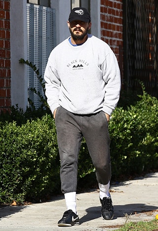 Shia LaBeouf wearing a fleecy jumper with grey joggers | ASOS Style Feed
