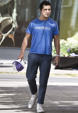 Shia LaBeouf wearing a blue tee with rolled-up smart trousers | ASOS Style Feed