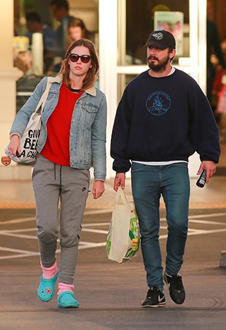 Shia LaBeouf wearing an oversized navy sweater with jeans | ASOS Style Feed