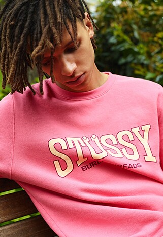 Model wearing a pink Stussy sweatshirt | ASOS Style Feed