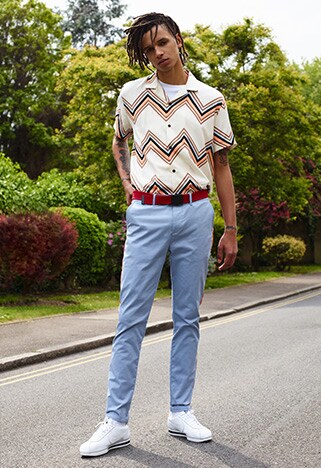 Model wearing a patterned shirt and light blue jeans | ASOS Style Feed