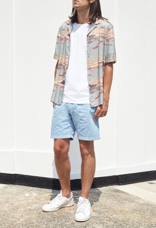 ASOSer wearing a patterned shirt with light blue shorts and white sneakers | ASOS Style Feed
