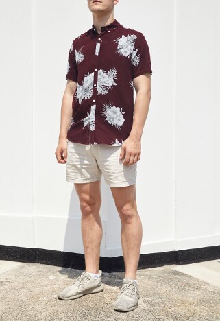 ASOSer wearing a burgundy shirt with matching stone shorts and sneakers | ASOS Style Feed