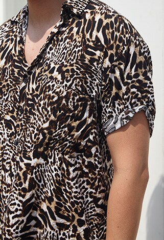 ASOSer wearing a leopard-print shirt with jean shorts and adidas sneakers | ASOS Style Feed