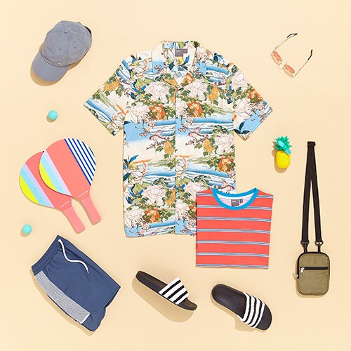 ASOS's summer-at-the-beach outfit, featuring adidas sliders, navy swim shorts and a retro tee | ASOS Style Feed