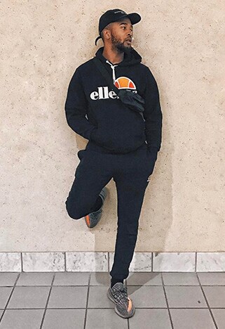 ASOS Insider Luce wearing an Ellesse tracksuit, a cross-body bag and dad cap | ASOS Style Feed  
