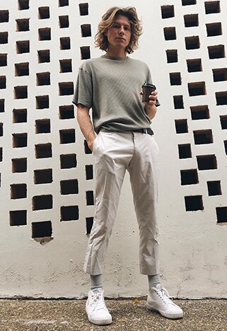 ASOS Insider Jono wearing light trousers, white plimsolls, grey socks and a knitted tee | ASOS Style Feed