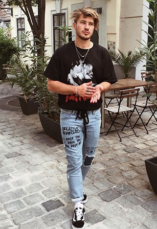 ASOS Insider Dennis wearing a boxy graphic tee and scribbled-on, light-washed jeans | ASOS Style Feed