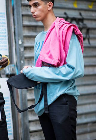 Street styler wearing pastel colours to enhance his tan | ASOS Style Feed