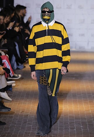 Catwalk model wearing a striped rugby shirt and baggy trousers | ASOS Style Feed