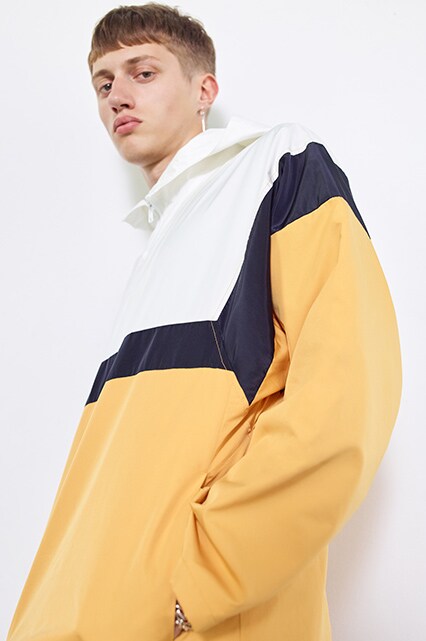 Model wearing a lightweight jacket in white, navy and yellow | ASOS Style Feed