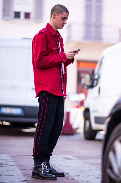 MFW SS18 Street Style featuring a street styler in a red shacket, side-stripe trousers and black lace-up boots | ASOS Style Feed