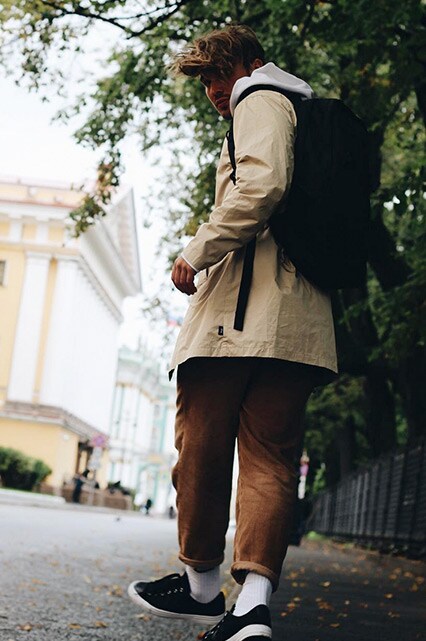 @asos_dennis wearing a cream jacket, white hoodie, tan corduroy trousers, black trainers and a black rucksack | ASOS Style Feed