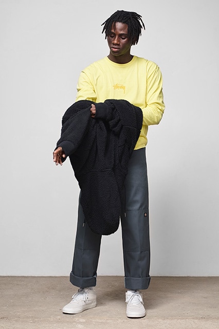 Model wearing dark Dickies work pants, a lemon-coloured long-sleeved T-shirt and Vans | ASOS Style Feed