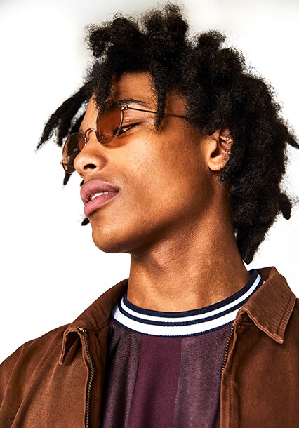 ASOS model wearing a brown T-shirt, brown Harrington jacket and round sunglasses | ASOS Style Feed