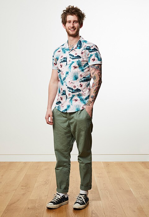 CRM artworker Tom wearing a Hawaiian shirt, work pants and Converse trainers available at ASOS | ASOS Style Feed
