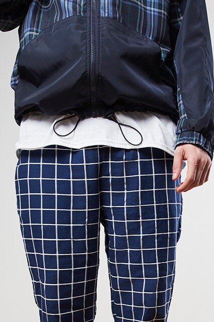 ASOSer wearing an all navy outfit with checked trousers and Converse trainers | ASOS Style Feed