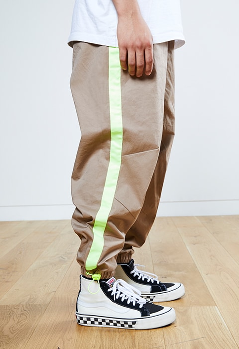 Nawal wearing a Richardson T-shirt, ASOS DESIGN joggers and Vans Sk8-Hi trainers | ASOS Style Feed