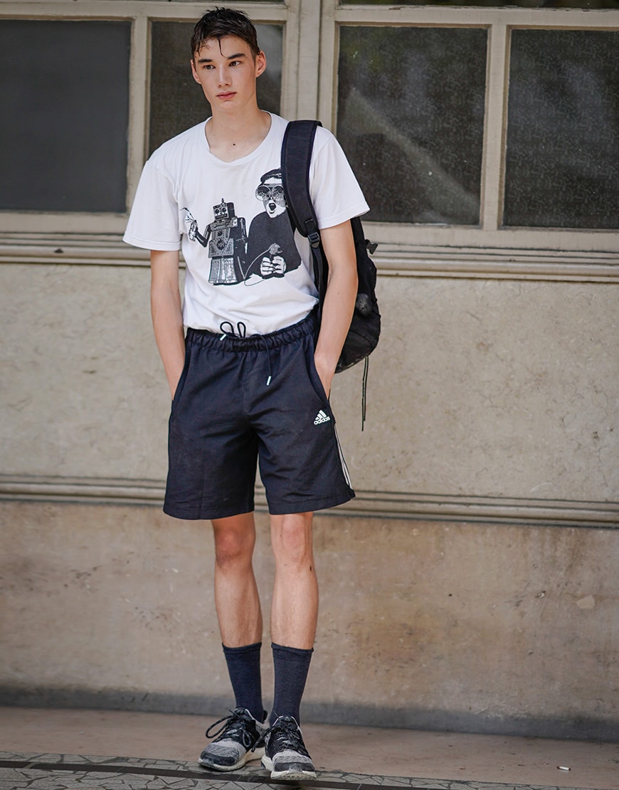 A model wearing shorts with tube socks and trainers | ASOS Style Feed