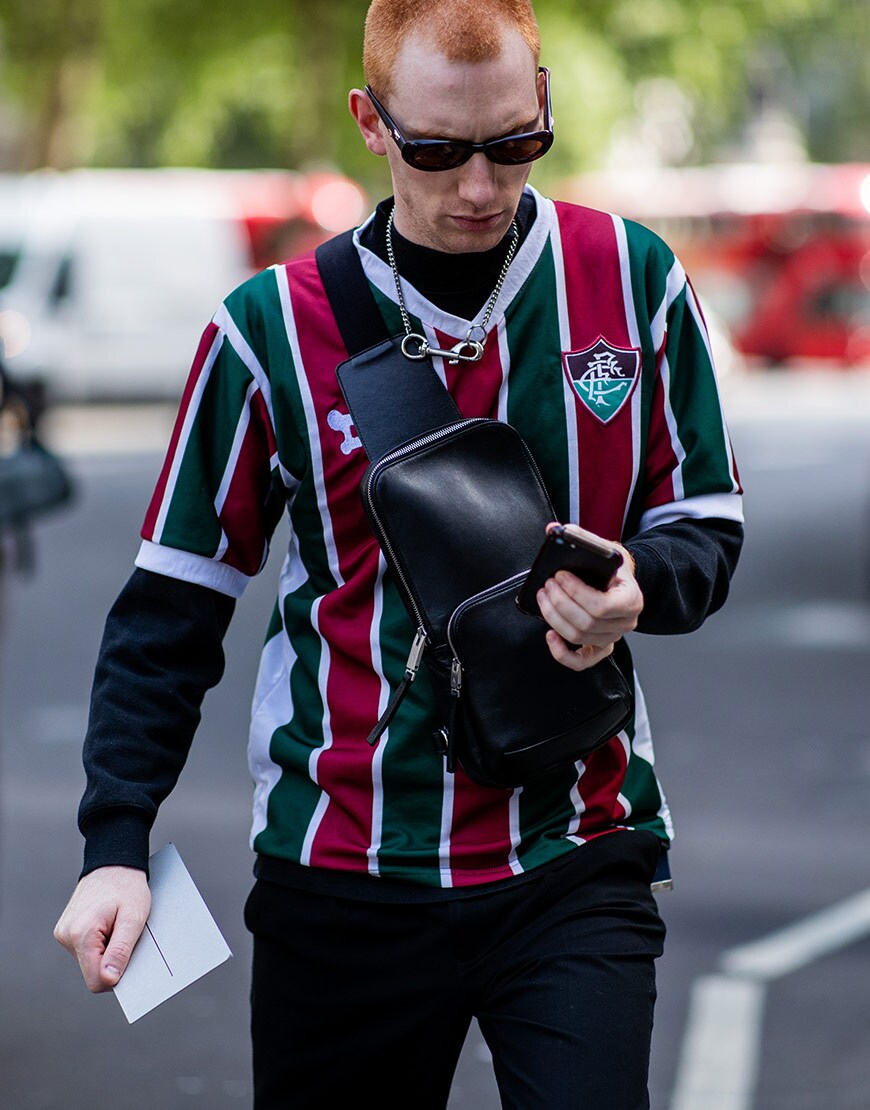 A street-styler wearing a football shirt | ASOS Style Feed