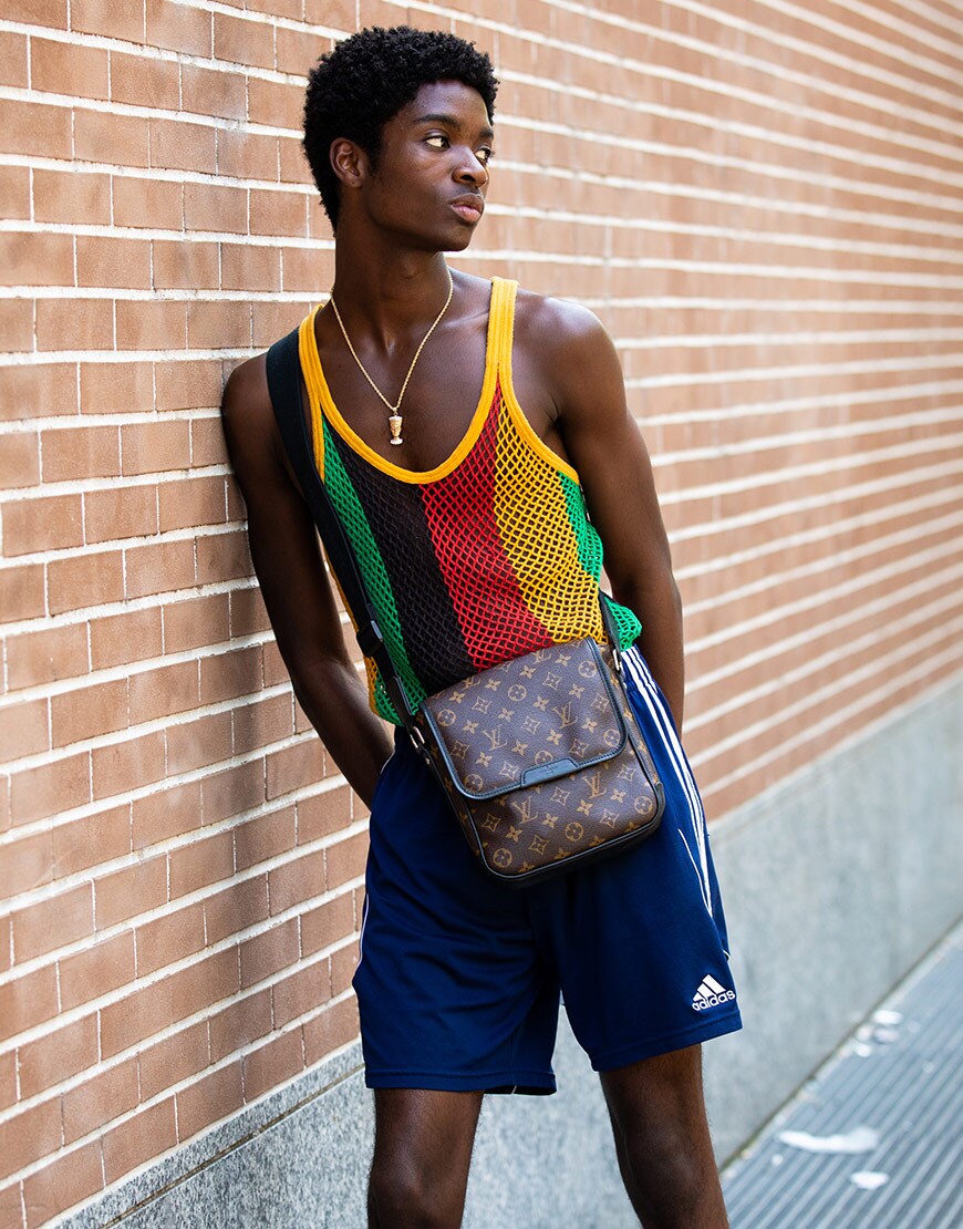 A model wearing a string vest and adidas shorts | ASOS Style Feed