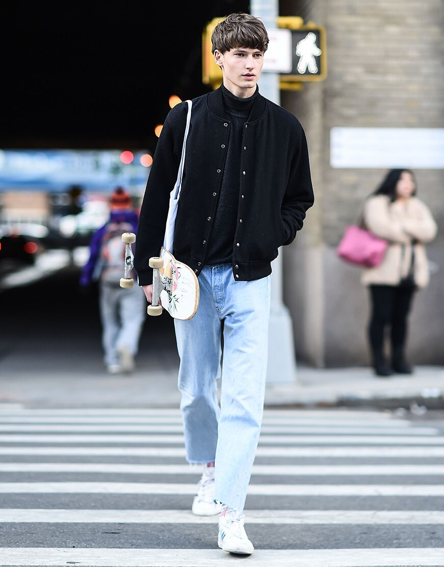 A street-styler wearing a bomber jacket, jeans and white trainers | ASOS Style Feed