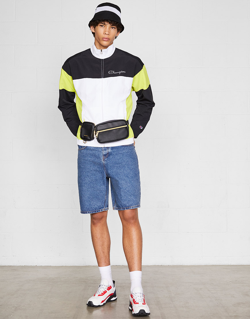 A model wearing a colour-block track jacket, denim shorts, chunky trainers, a bucket hat and a bum bag | ASOS Style Feed