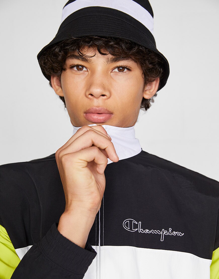 A model wearing a colour-block track jacket and a bucket hat | ASOS Style Feed