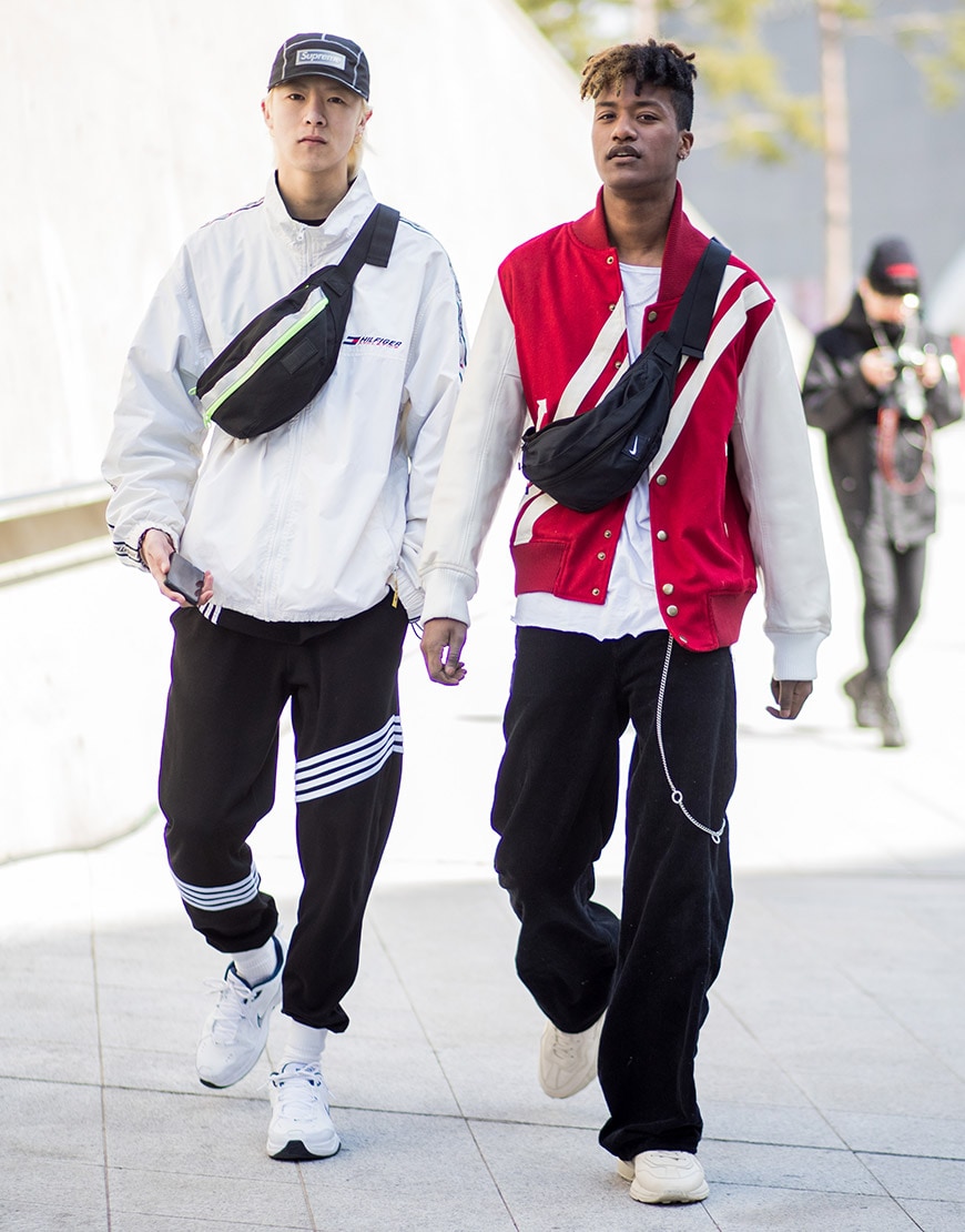 A pair of street-stylers wearing tracksuit separates and cross-body bags | ASOS Style Feed