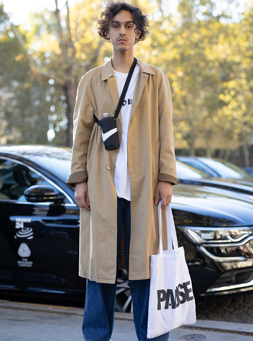 Fashion week showgoer in a trench coat | ASOS Style Feed