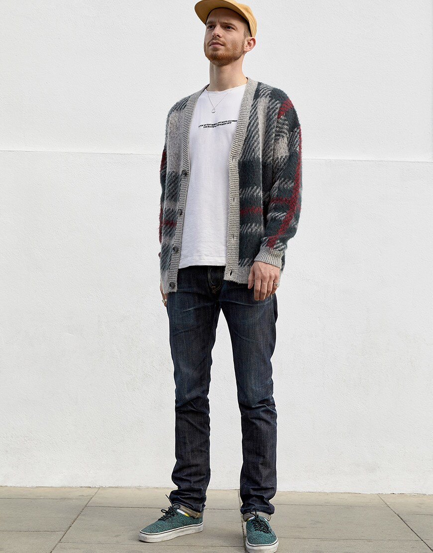 Nic wearing a Norse Projects cap, Rory-Johnn tee, ASOS DESIGN cardigan, Edwin ED-55 jeans, Vans Authentics | ASOS Style Feed