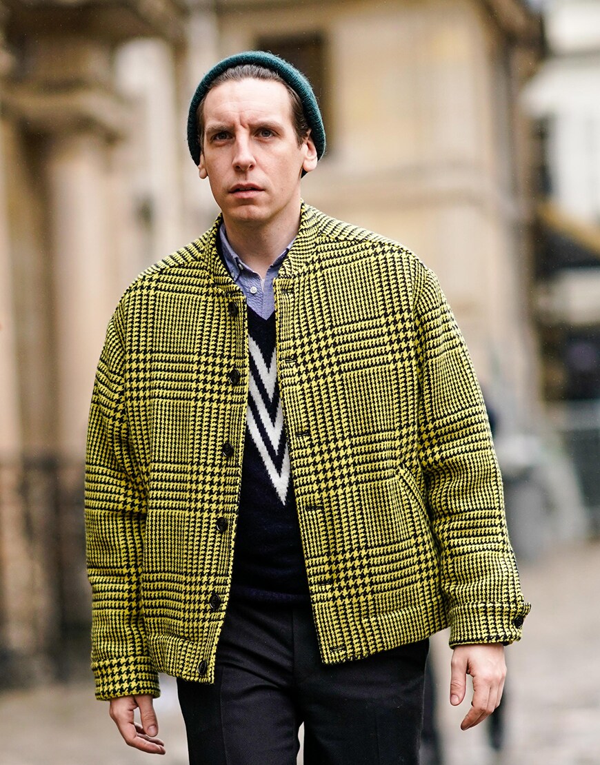 A street-styler in a beanie hat and yellow checked coat | ASOS Style Feed