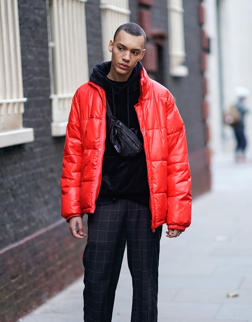 A street-styler in a hoodie, puffer jacket and check trousers | ASOS Style Feed