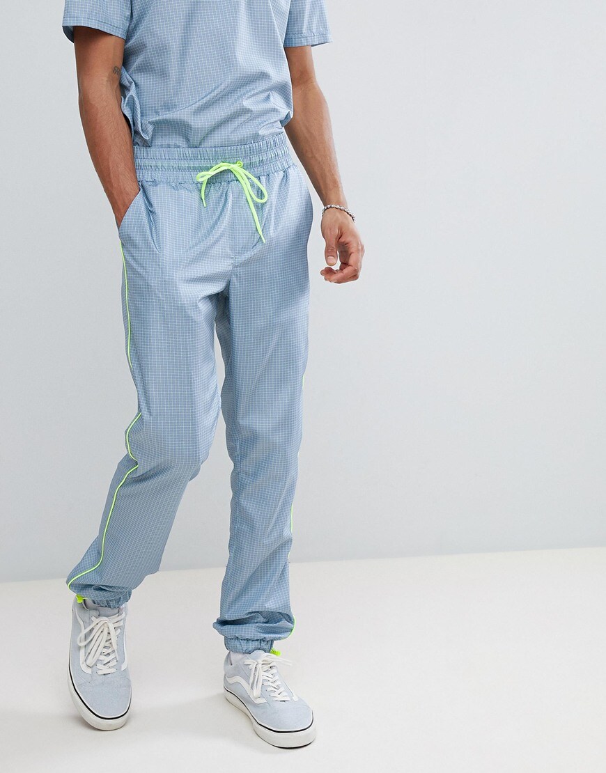 ASOS DESIGN - ensemble - Pantalon de jogging ajusté en tissu avec taille élastiquée - Carreaux gris avec passepoil fluo
