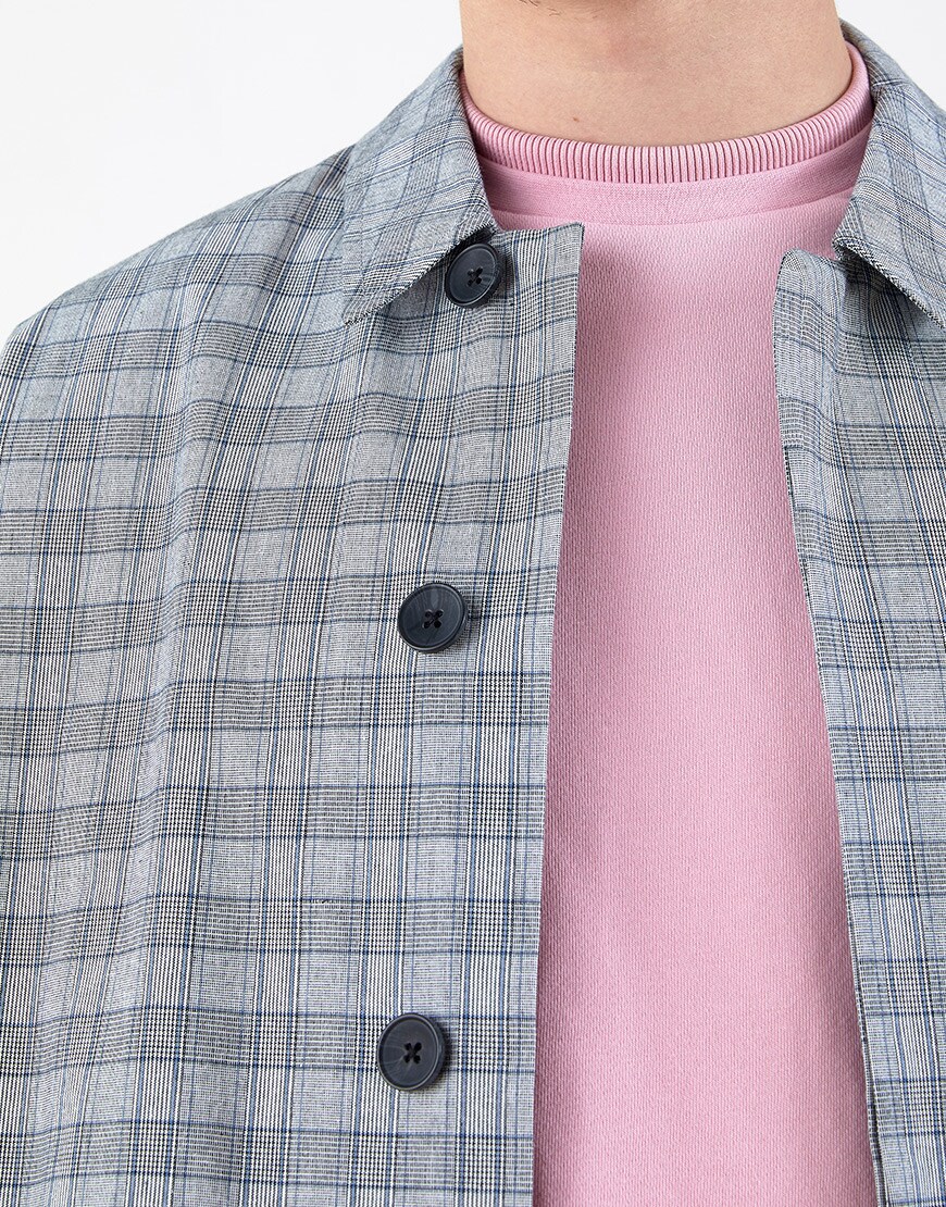 A close-up of Seb's pink sweatshirt and a check ASOS WHITE coat | ASOS Style Feed