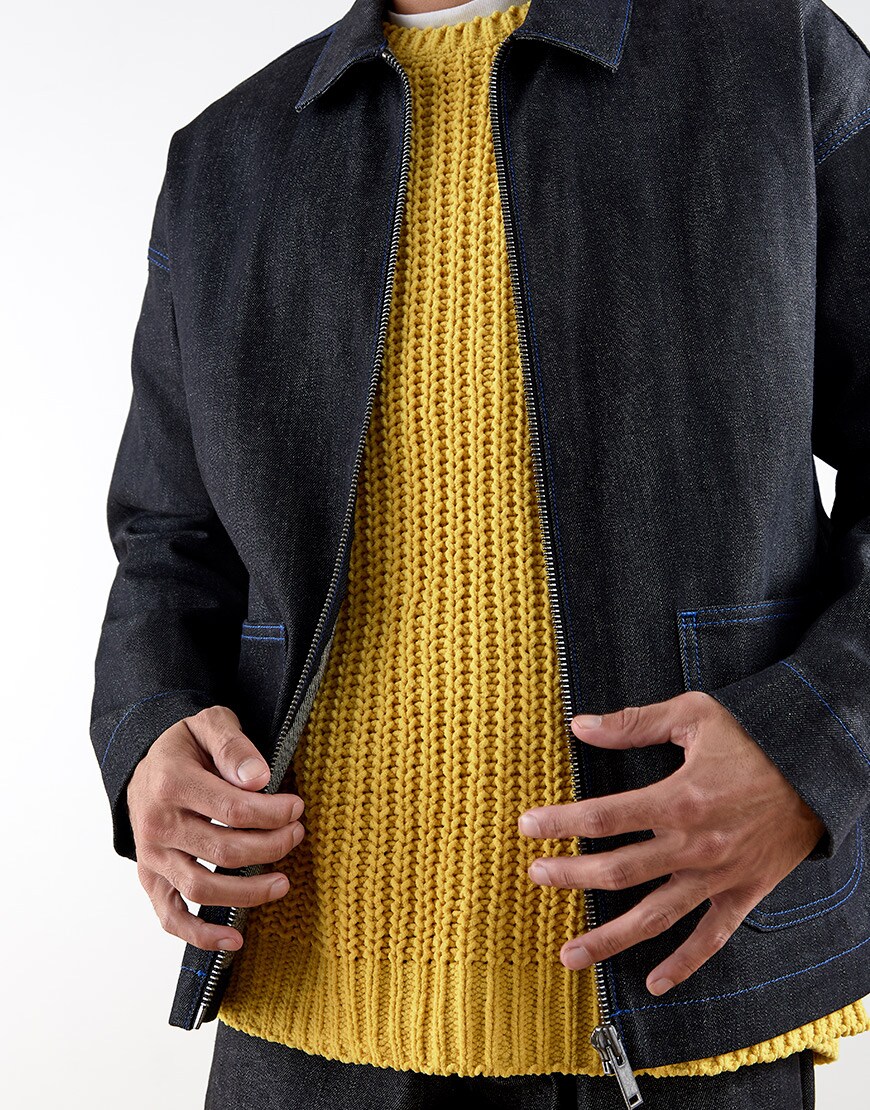 A close-up of Claud's yellow knitted jumper and ASOS WHITE denim jacket | ASOS Style Feed