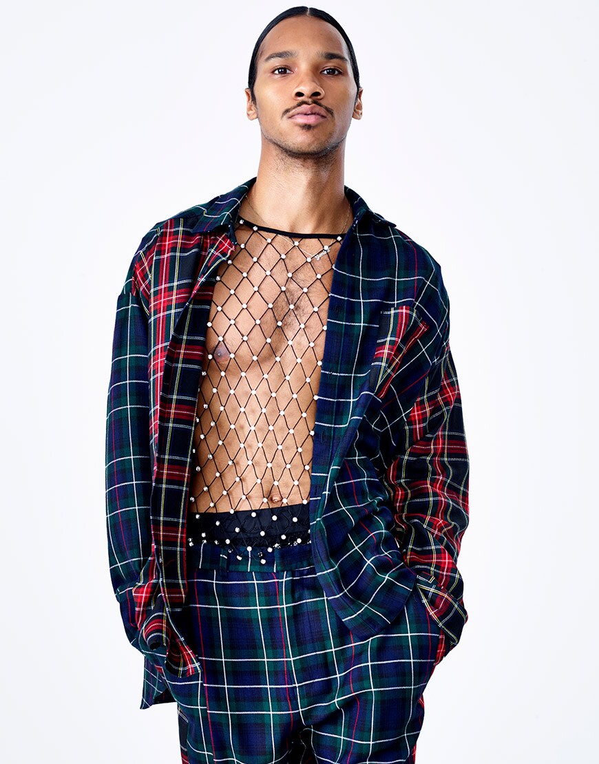 A model wearing a net T-shirt and checked co-ord from the ASOS DESIGN x LaQuan Smith range available at ASOS | ASOS Style Feed