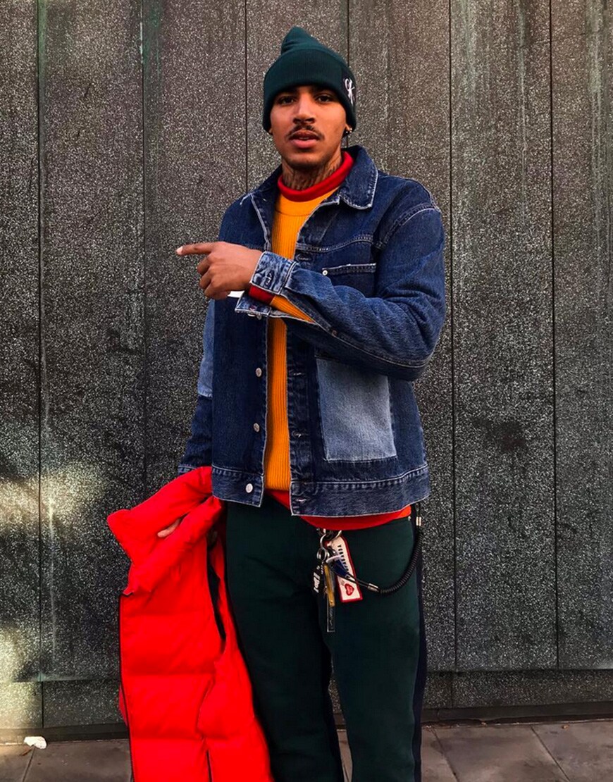 @asos_ruddy wearing an orange top, green beanie, green trousers and a dark-wash denim jacket | ASOS Style Feed