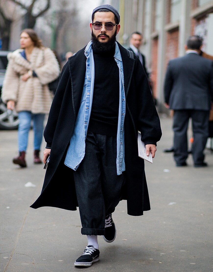 A street-styler wearing double denim and a black coat | ASOS Style Feed