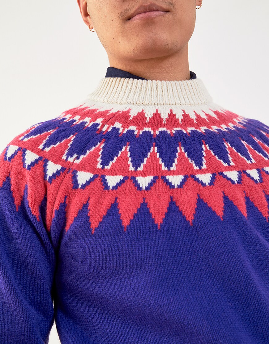 A close-up of Nawal's patterned knitted jumper | ASOS Style Feed