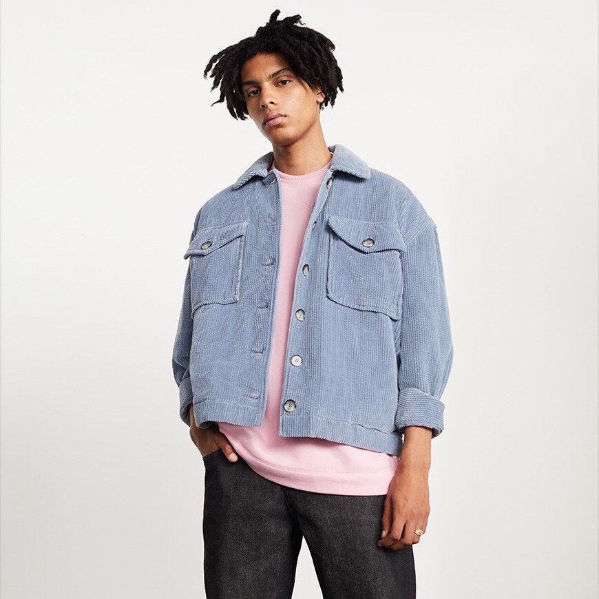 A model wearing a pink T-shirt and pale-blue corduroy jacket | ASOS Style Feed