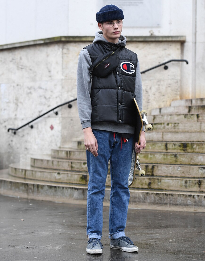 A stylish guy in Champion gilet and blue beanie