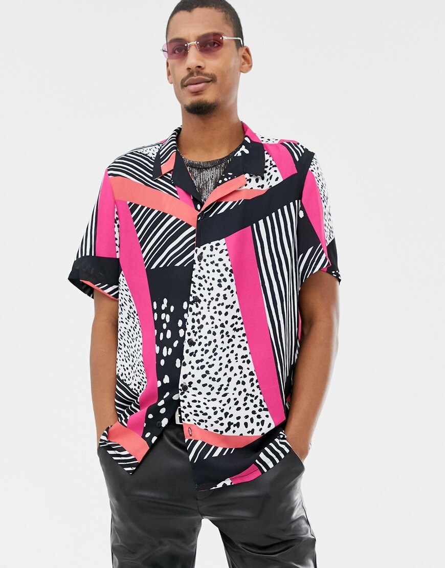 A picture of a model wearing a vibrant, pattern-clashing shirt. Available on ASOS