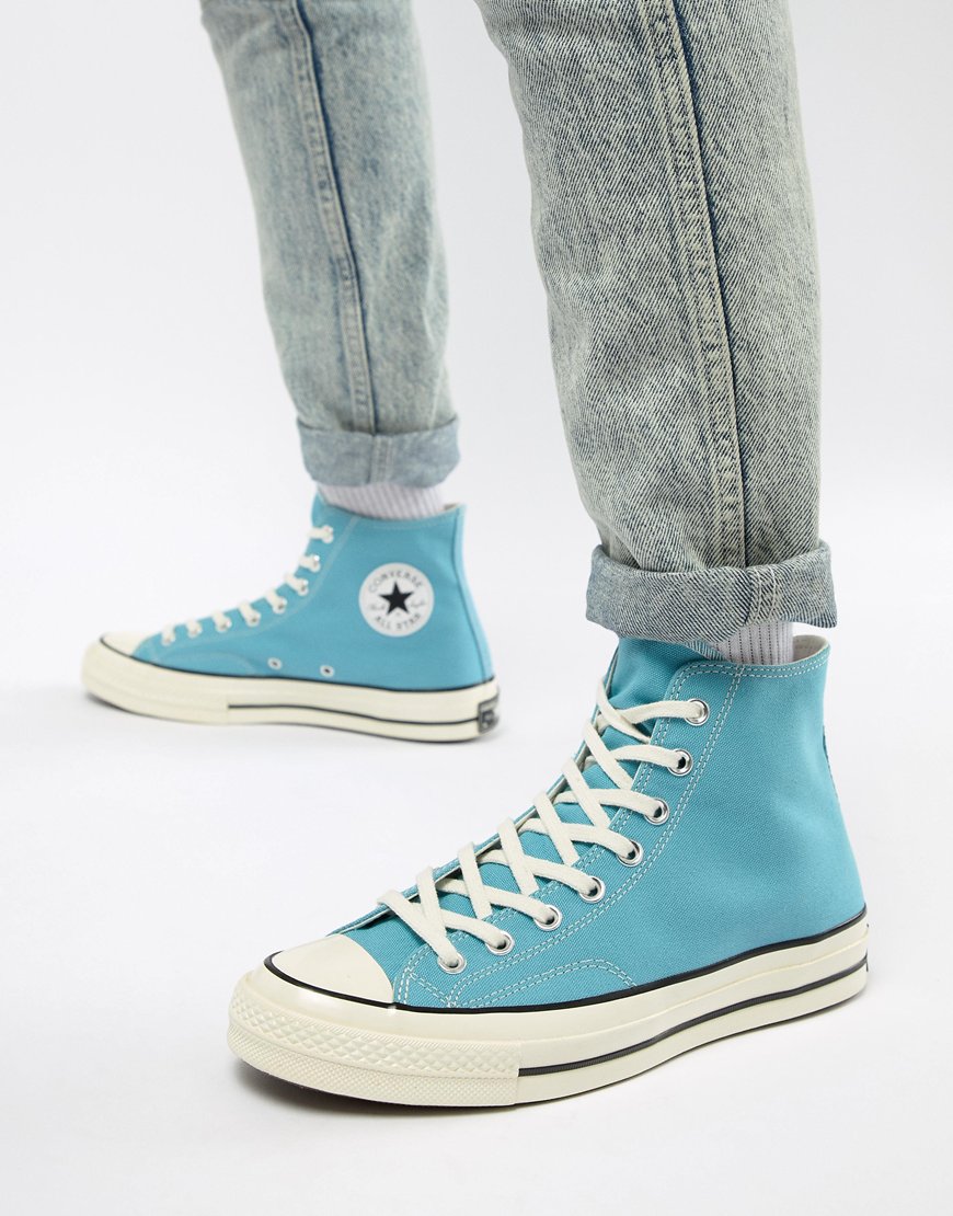 A photo of a pair of light blue, Converse All Stars. Available on ASOS