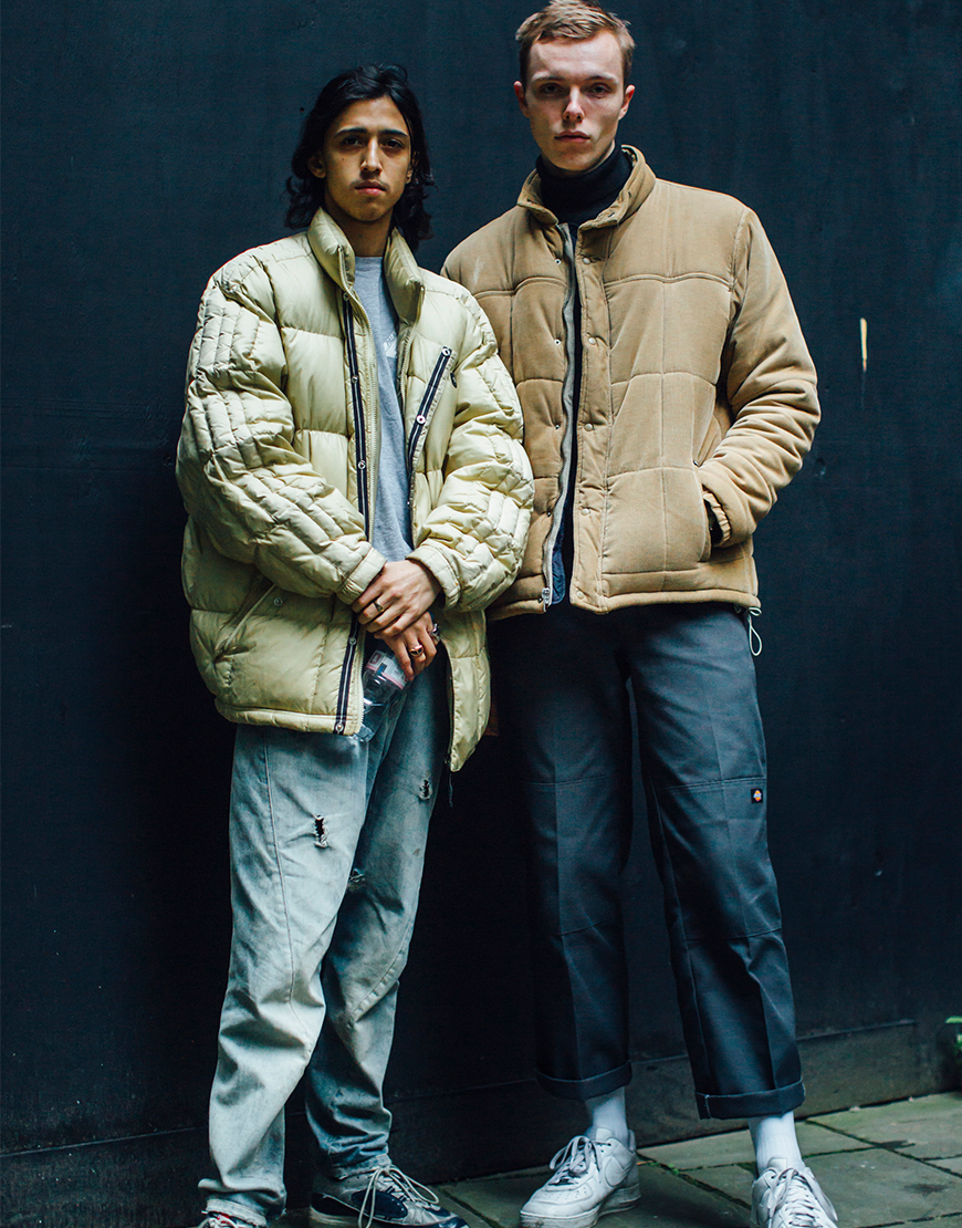 A picture of two streetstylers wearing puffer jackets, a roll neck and Dickies work pants