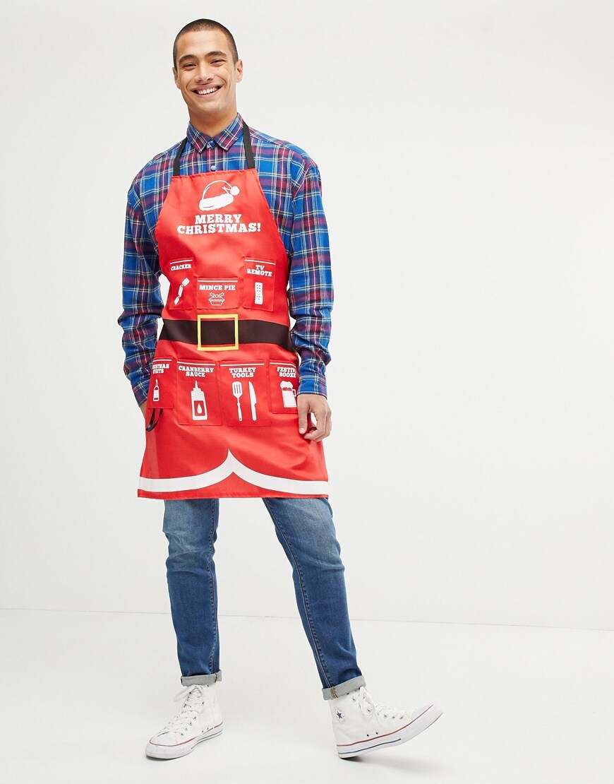 A model wearing a Fizz Christmas apron available at ASOS | ASOS Style Feed
